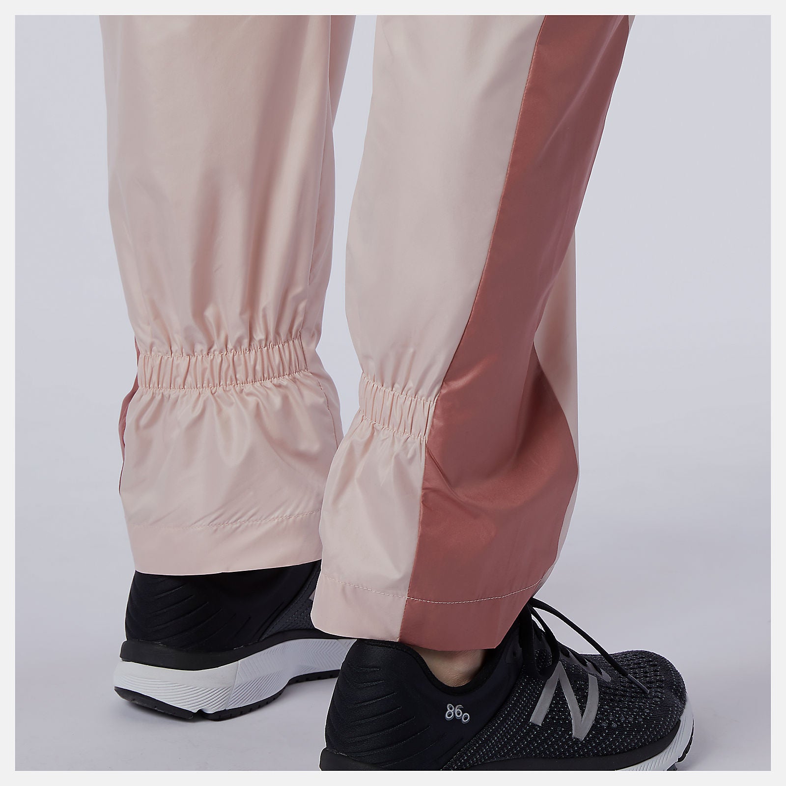 Oyster Pink NB Athletics Higher Learning Wind Pant New Balance Clothing